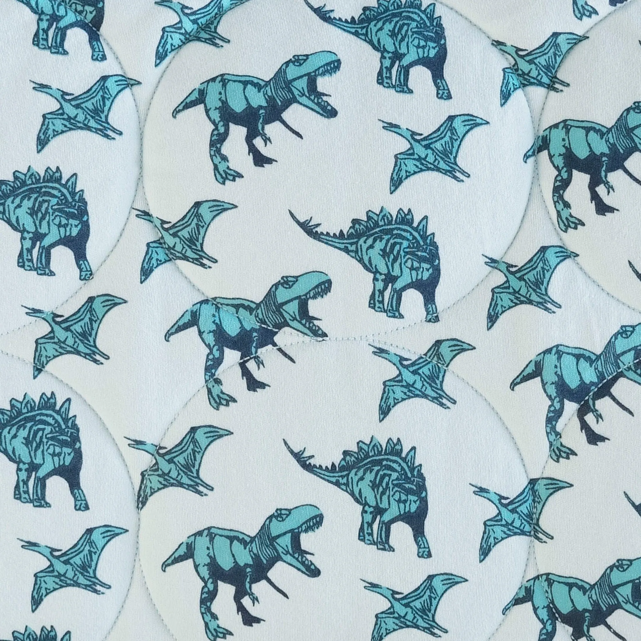classic circle quilt | aqua dinosaurs | organic cotton interlock
